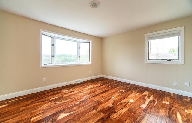 251 Forest Rd, North Branford, CT 06472 - unfurnished room featuring wood finished floors, healthy amount of natural light, and baseboards