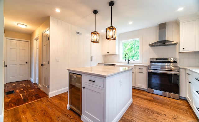 251 Forest Rd, North Branford, CT 06472 - kitchen featuring electric range, wall chimney range hood, beverage cooler, dark wood-type flooring, and white cabinets