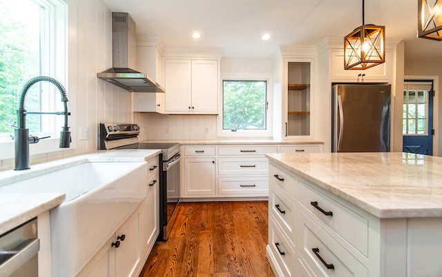 251 Forest Rd, North Branford, CT 06472 - kitchen with wall chimney range hood, appliances with stainless steel finishes, dark wood-style flooring, plenty of natural light, and recessed lighting