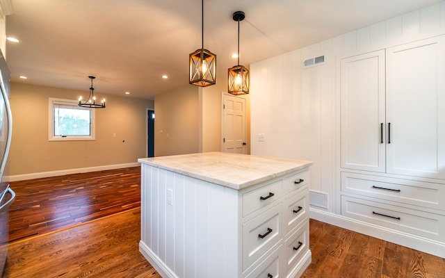251 Forest Rd, North Branford, CT 06472 - kitchen featuring dark wood-style flooring, a chandelier, a center island, baseboards, and white cabinetry