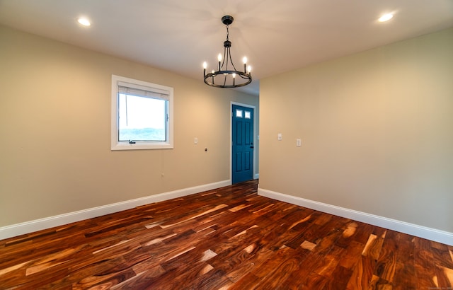 251 Forest Rd, North Branford, CT 06472 - unfurnished room with a chandelier, baseboards, dark wood finished floors, and recessed lighting