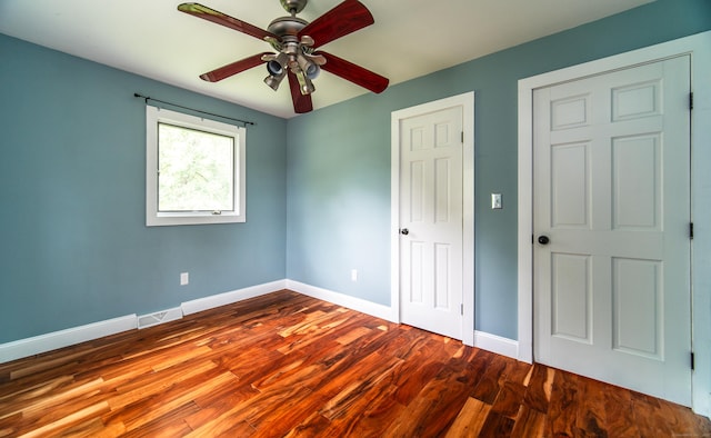 251 Forest Rd, North Branford, CT 06472 - unfurnished bedroom with wood finished floors, baseboards, and ceiling fan