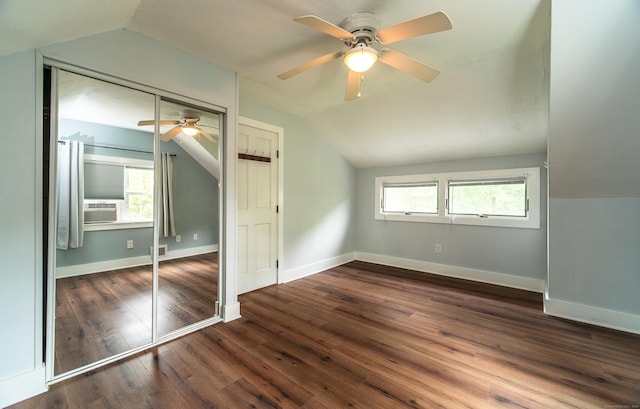 251 Forest Rd, North Branford, CT 06472 - unfurnished bedroom with lofted ceiling, multiple windows, a closet, dark wood-type flooring, and baseboards