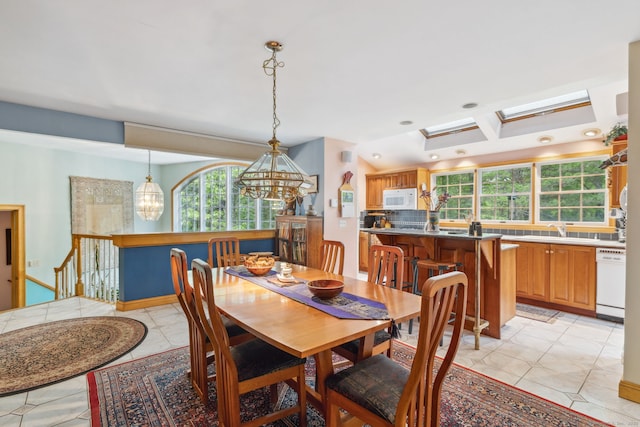 143 Petticoat Ln, East Haddam, CT 06423 - dining room featuring a chandelier, a skylight, light tile patterned floors, and recessed lighting