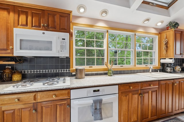 143 Petticoat Ln, East Haddam, CT 06423 - kitchen featuring white appliances, a sink, healthy amount of natural light, and tasteful backsplash
