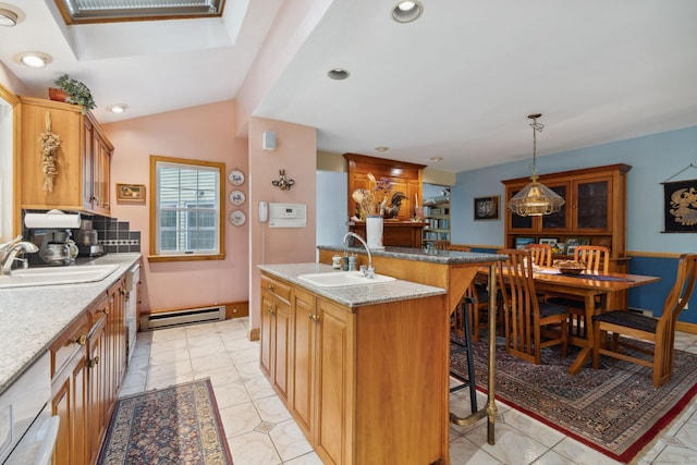 143 Petticoat Ln, East Haddam, CT 06423 - kitchen featuring a sink, a baseboard radiator, a breakfast bar, an island with sink, and recessed lighting