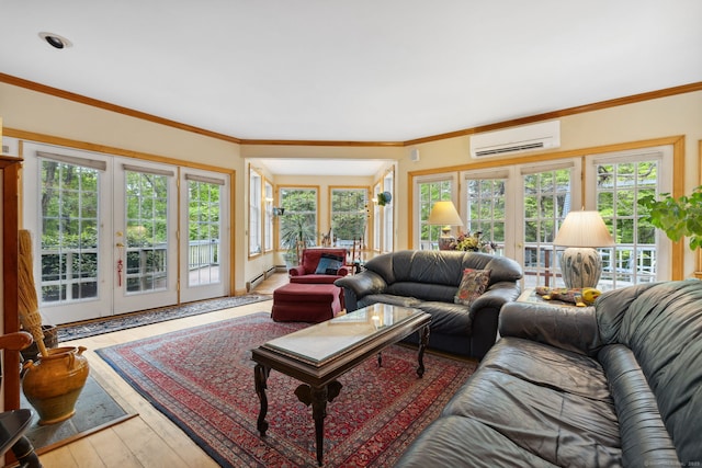 143 Petticoat Ln, East Haddam, CT 06423 - living area with a wall mounted AC, hardwood / wood-style floors, french doors, and a baseboard heating unit