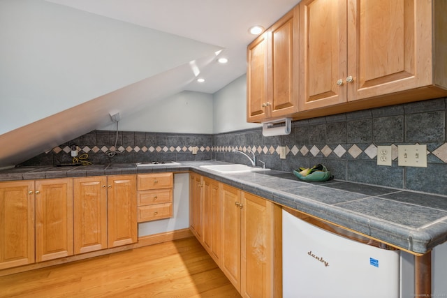 143 Petticoat Ln, East Haddam, CT 06423 - kitchen featuring vaulted ceiling, light wood finished floors, a sink, and backsplash