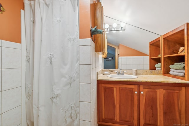 143 Petticoat Ln, East Haddam, CT 06423 - full bathroom featuring vanity, lofted ceiling, tile walls, and a shower with curtain