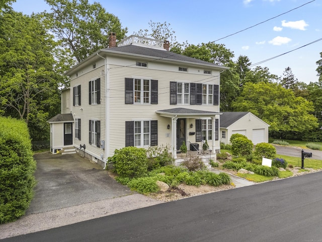9 Rathbun Pl, Groton, CT 06355 - greek revival inspired property featuring a chimney, a garage, an outbuilding, asphalt driveway, and entry steps