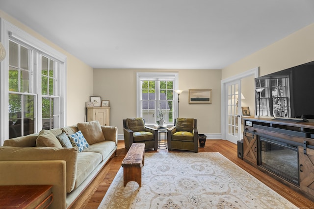 9 Rathbun Pl, Groton, CT 06355 - living area featuring wood finished floors, baseboards, and french doors