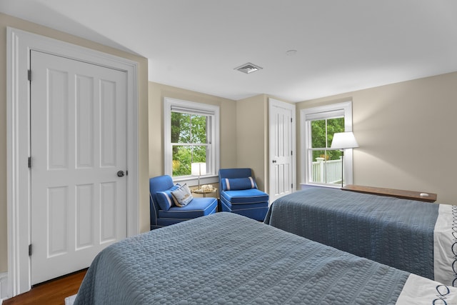9 Rathbun Pl, Groton, CT 06355 - bedroom featuring dark wood-type flooring and multiple windows