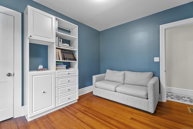 9 Rathbun Pl, Groton, CT 06355 - sitting room with wood finished floors and baseboards