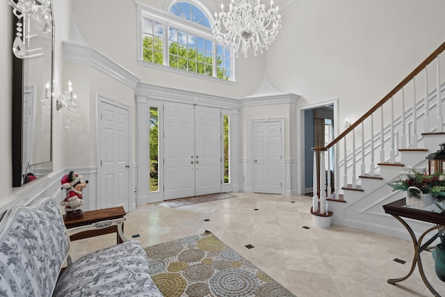 8 Hollow Oak Rd, Woodbridge, CT 06525 - foyer featuring a high ceiling, stairway, a chandelier, and tile patterned flooring