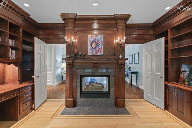 8 Hollow Oak Rd, Woodbridge, CT 06525 - unfurnished living room with crown molding, light wood-type flooring, a high end fireplace, and recessed lighting