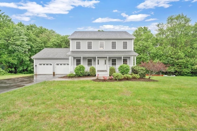 244 S St, Vernon, CT 06066 - colonial inspired home featuring covered porch, asphalt driveway, a garage, and a front lawn