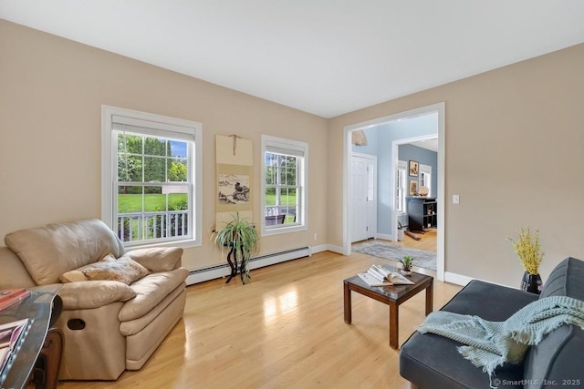 244 S St, Vernon, CT 06066 - living room featuring a baseboard radiator, light wood-style flooring, and baseboards