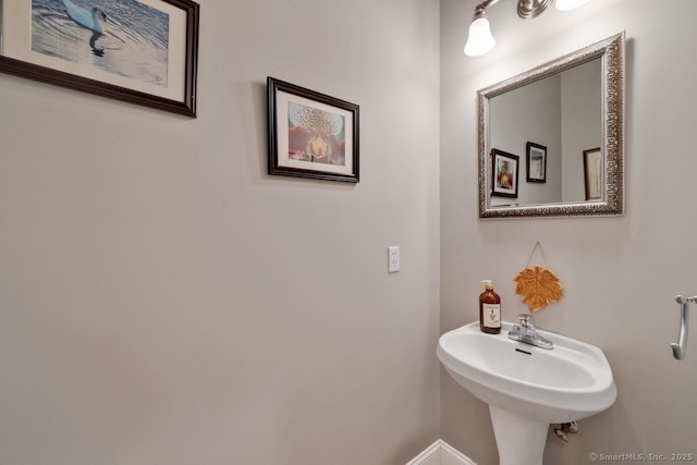 244 S St, Vernon, CT 06066 - bathroom with baseboards and a sink