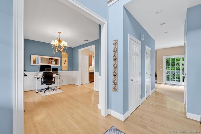 244 S St, Vernon, CT 06066 - hall with wood finished floors, a chandelier, a desk, and baseboards