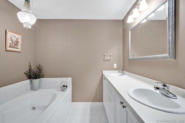 244 S St, Vernon, CT 06066 - bathroom with tile patterned flooring, double vanity, a bath, baseboards, and a chandelier