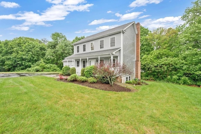 244 S St, Vernon, CT 06066 - colonial inspired home with a chimney, a front yard, and covered porch