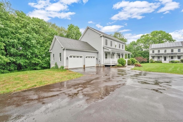 244 S St, Vernon, CT 06066 - view of front of property featuring driveway, a garage, covered porch, and a front lawn