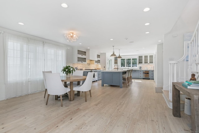 5 Compo Hill Ave, Westport, CT 06880 - dining area featuring beverage cooler, light wood-style floors, and recessed lighting