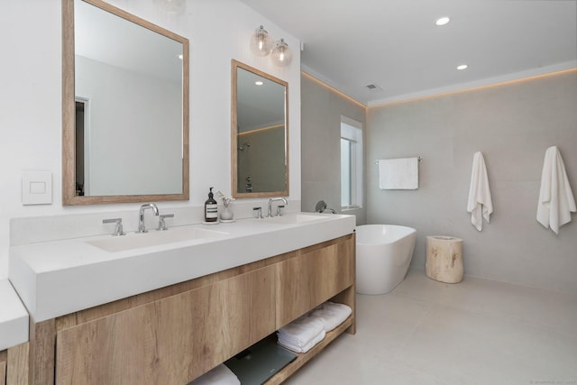 5 Compo Hill Ave, Westport, CT 06880 - bathroom with a freestanding bath, double vanity, and recessed lighting