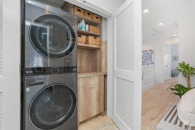 5 Compo Hill Ave, Westport, CT 06880 - laundry room with stacked washer and clothes dryer, attic access, and light wood finished floors