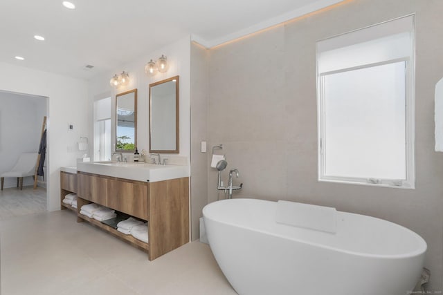 5 Compo Hill Ave, Westport, CT 06880 - bathroom featuring double vanity, a freestanding bath, and recessed lighting