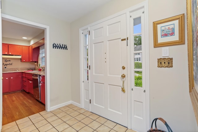10 Crossland Pl, Norwalk, CT 06851 - foyer with healthy amount of natural light, light tile patterned flooring, and baseboards