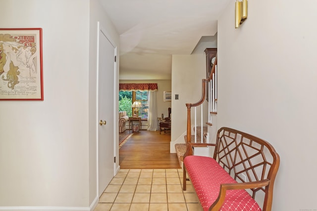10 Crossland Pl, Norwalk, CT 06851 - hallway featuring light tile patterned floors, stairway, and baseboards