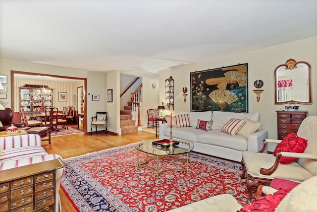 10 Crossland Pl, Norwalk, CT 06851 - living area featuring wood finished floors, stairs, and a chandelier