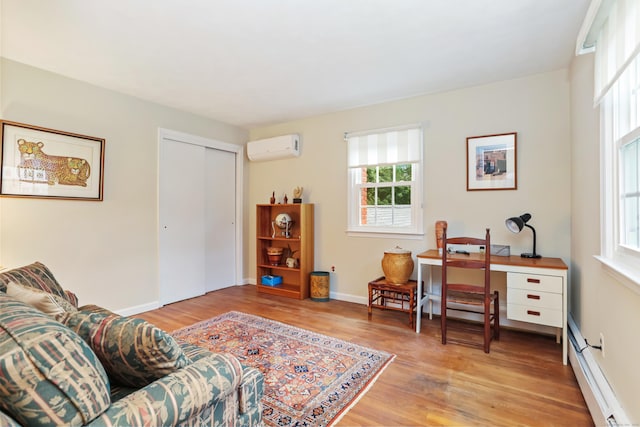 10 Crossland Pl, Norwalk, CT 06851 - living room featuring a wall unit AC, a baseboard radiator, light wood-style floors, and baseboards