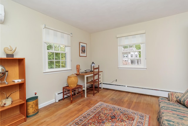 10 Crossland Pl, Norwalk, CT 06851 - office space featuring wood finished floors, a wall unit AC, baseboards, and a baseboard radiator