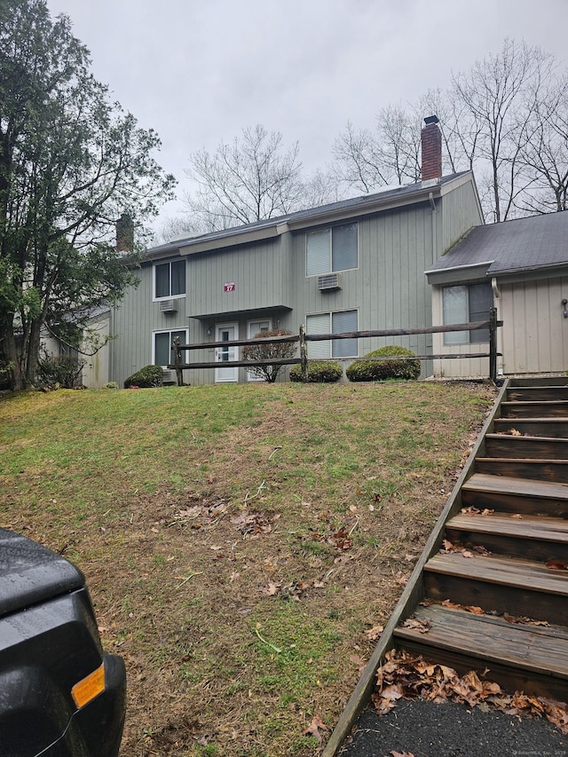 19 Polpis Ln Unit 19, Guilford, CT 06437 - back of house featuring stairway and a chimney