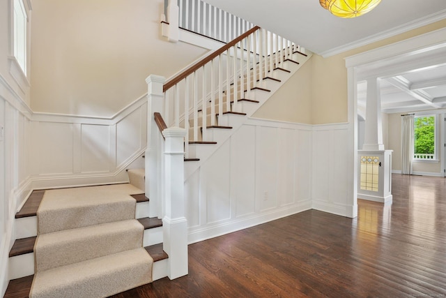 128 Chestnut Hill Rd, Killingworth, CT 06419 - staircase featuring a decorative wall, wood finished floors, ornate columns, wainscoting, and crown molding