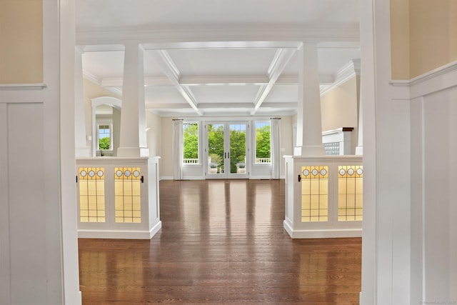 128 Chestnut Hill Rd, Killingworth, CT 06419 - unfurnished living room featuring wood finished floors, beamed ceiling, coffered ceiling, ornamental molding, and a decorative wall