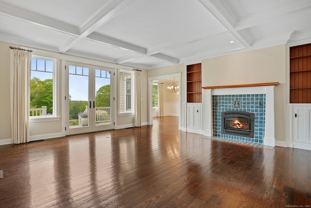 128 Chestnut Hill Rd, Killingworth, CT 06419 - unfurnished living room featuring a chandelier, wood finished floors, a tiled fireplace, coffered ceiling, and beamed ceiling