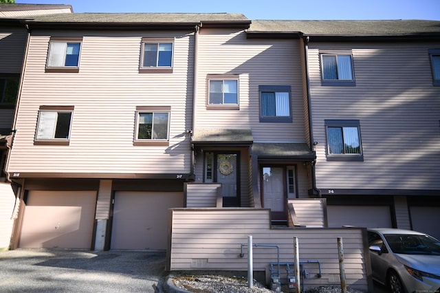196 New Haven Ave Unit 217, Derby, CT 06418 - view of property with an attached garage and driveway