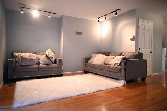 196 New Haven Ave Unit 217, Derby, CT 06418 - living room featuring track lighting, wood finished floors, and baseboards
