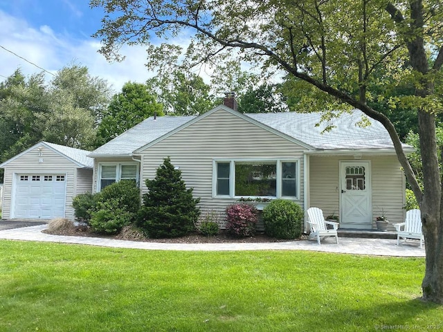 9 Lakeview Park, Columbia, CT 06237 - view of front of home with a front yard, a chimney, and a garage