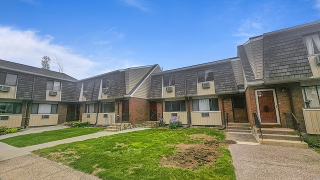 300 High Path Rd Unit 300, Windsor, CT 06095 - view of front of house featuring brick siding, mansard roof, a front yard, and entry steps