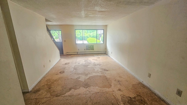 300 High Path Rd Unit 300, Windsor, CT 06095 - empty room with a textured ceiling, baseboard heating, and baseboards