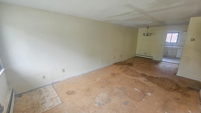 300 High Path Rd Unit 300, Windsor, CT 06095 - empty room featuring a baseboard radiator and baseboards