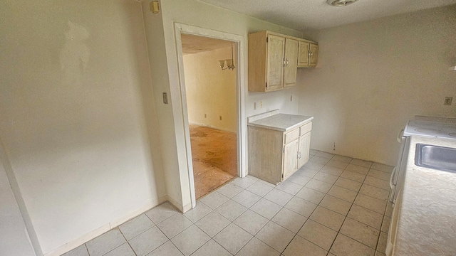300 High Path Rd Unit 300, Windsor, CT 06095 - kitchen with light countertops, light tile patterned flooring, a sink, and light brown cabinets
