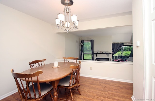 198 Mattabasset Dr Unit 198, Meriden, CT 06450 - dining area featuring a chandelier, wood finished floors, and baseboards