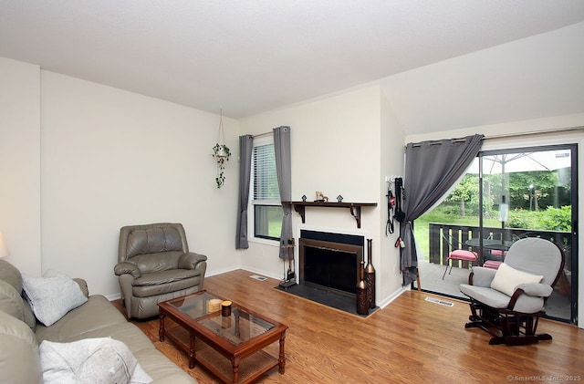 198 Mattabasset Dr Unit 198, Meriden, CT 06450 - living room with wood finished floors, baseboards, and a fireplace with flush hearth