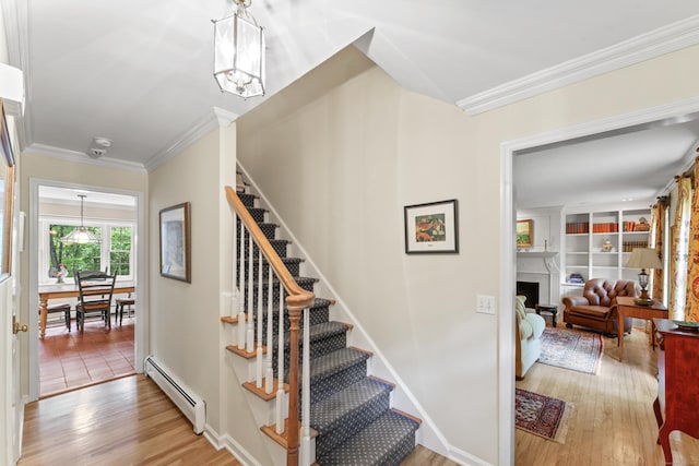 6 Middlebrook Pond Rd, Redding, CT 06896 - staircase with baseboard heating, wood finished floors, a fireplace, ornamental molding, and a chandelier