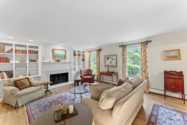 6 Middlebrook Pond Rd, Redding, CT 06896 - living room featuring crown molding, baseboard heating, light wood finished floors, a fireplace with raised hearth, and recessed lighting